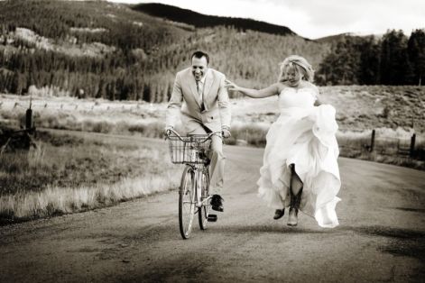 07-groom-riding-bike-bride-running-boots-dress.jpg